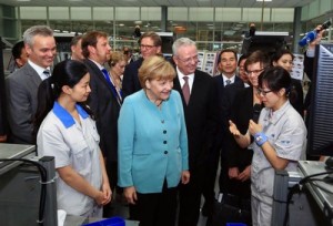 Volkswagen signs declaration in the presence of German Chancellor Angela Merkel and Chinese Premier Li Keqiang, to expand production capacity