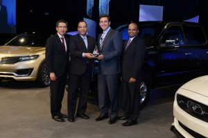 Comstar Automotive CEO & President Sat Mohan Gupta receiving the award from Mark Fields (COO, Ford Motor Co).  Hau Thai-Tang, Group vice president, Ford Global Purchasing and Raj Nair, Group vice President, Global Product Development are also present  