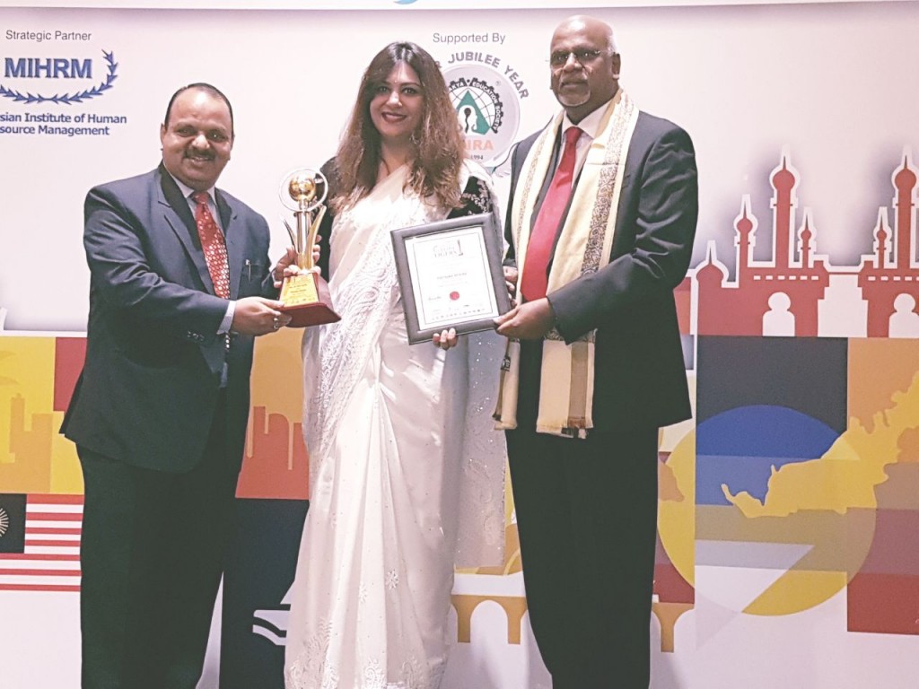 Priyanka Behera receiving Hall of Fame The Golden Globe Tigers Award in individual CSR Category